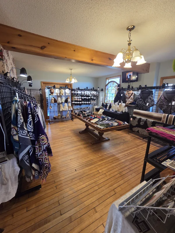 The Laslyn Alpaca shop in the farm house, with knitted goods and blankets on display